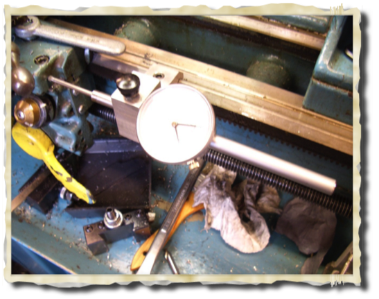 Carriage micrometer holder. Helpful when exact or duplicate dimensions are needed.