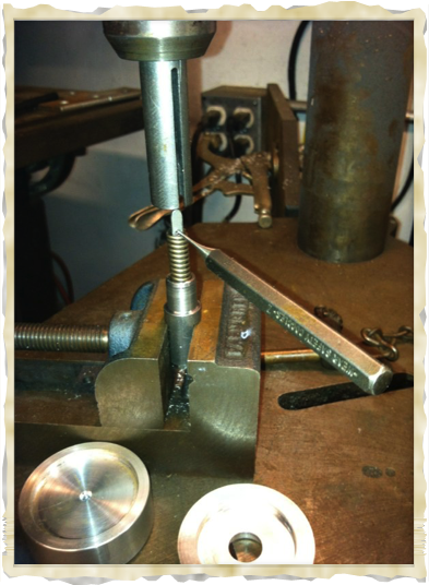 Hammer spring installation jig.
Easy to use and keeps from launching into oblivion.
Here shown in a drill press which is the preferred method.